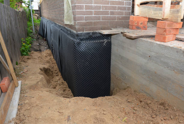 Happy homeowners after waterproofing job in Pomeroy